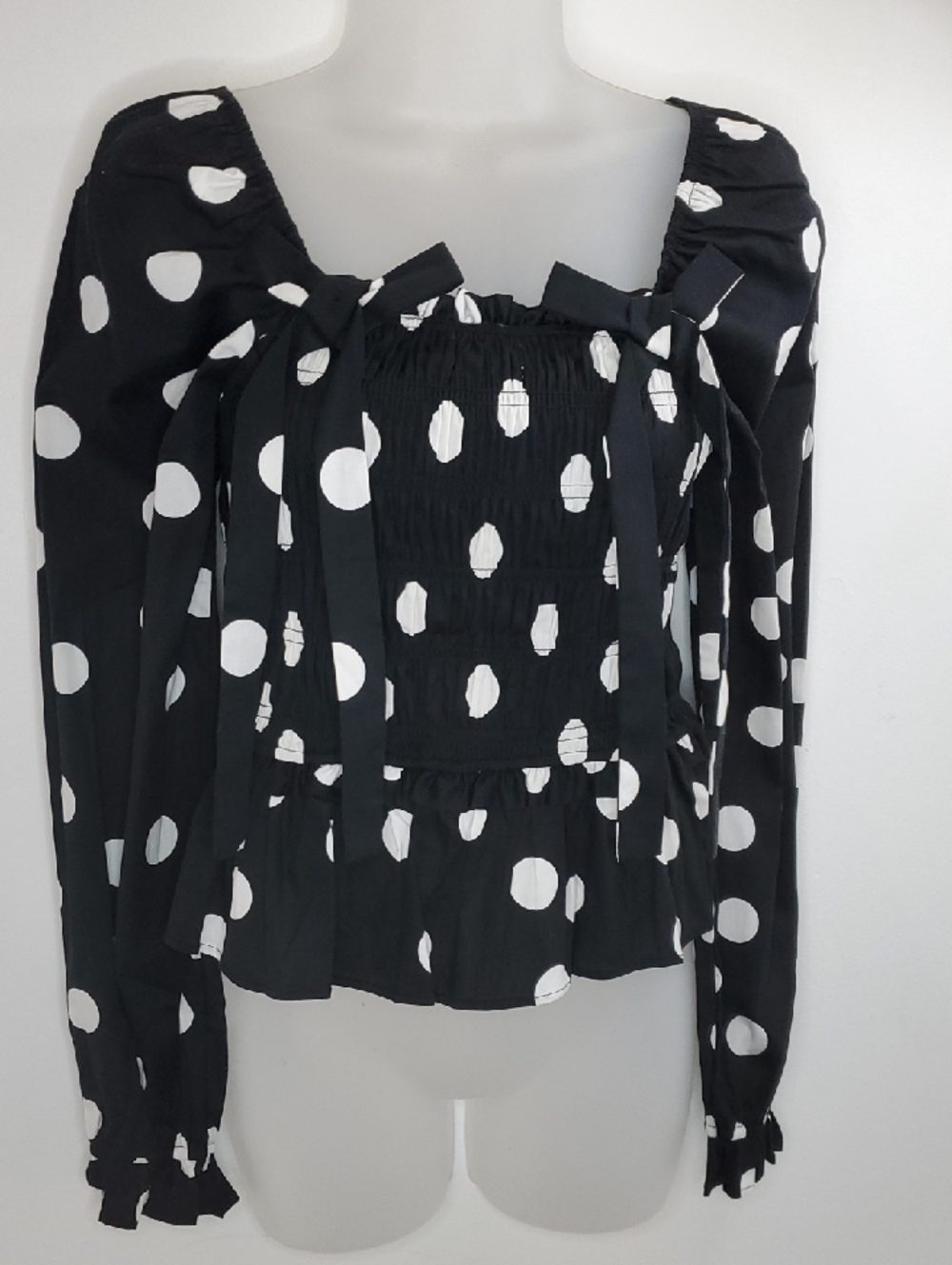 Francesca's Collections Black and White Polka Dot Long-Sleeve Smocked Peplum Top